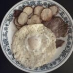 steak, dippy eggs and fried potatoes