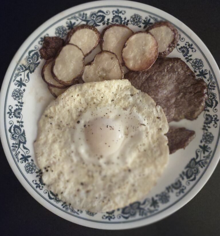 steak, dippy eggs and fried potatoes