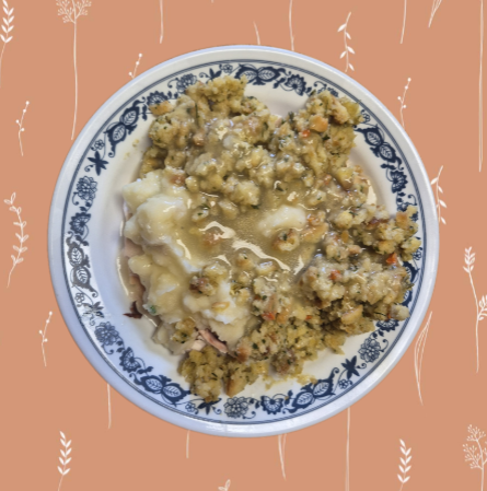 Roasted Chicken served with mashed potatoes, stuffing and smothered in gravy