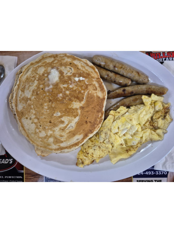 Pancakes, scrambled eggs with sausage links served at Kastners Cafe