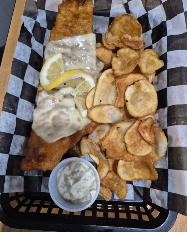 Fish Basket with Fried Haddock topped with cheese and homemade chips from Churchills Sports Lounge