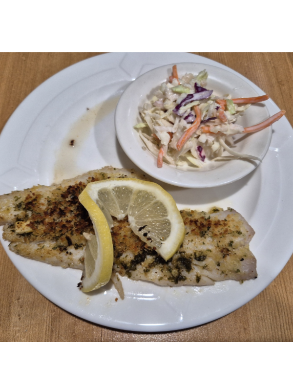 Baked Haddock served with cole slaw from Churchills Sports Lounge