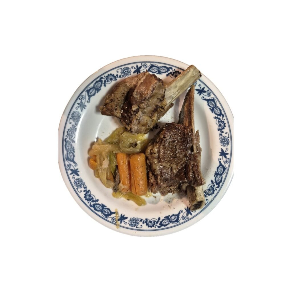 plate showing Beef short ribs with carrots, celery and onions