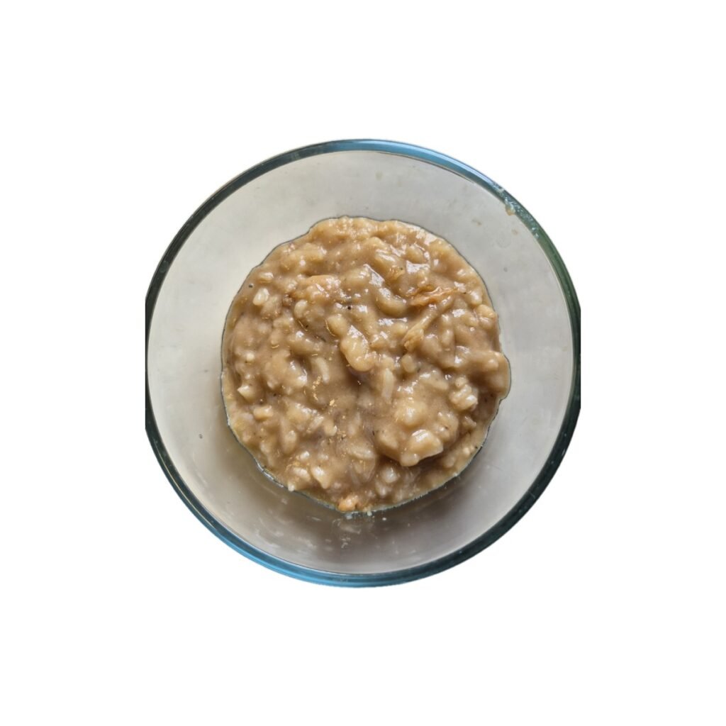 bowl filled with rice covered with thick beef gravy