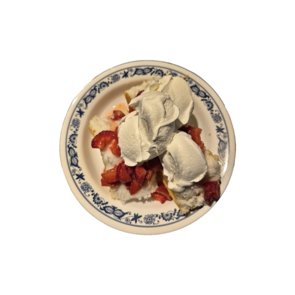 plqate filled with shortcake covered with strawberries and whipped topping