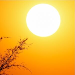 Bright orange sun symbolizing extreme heat conditions during a dangerous heat wave.